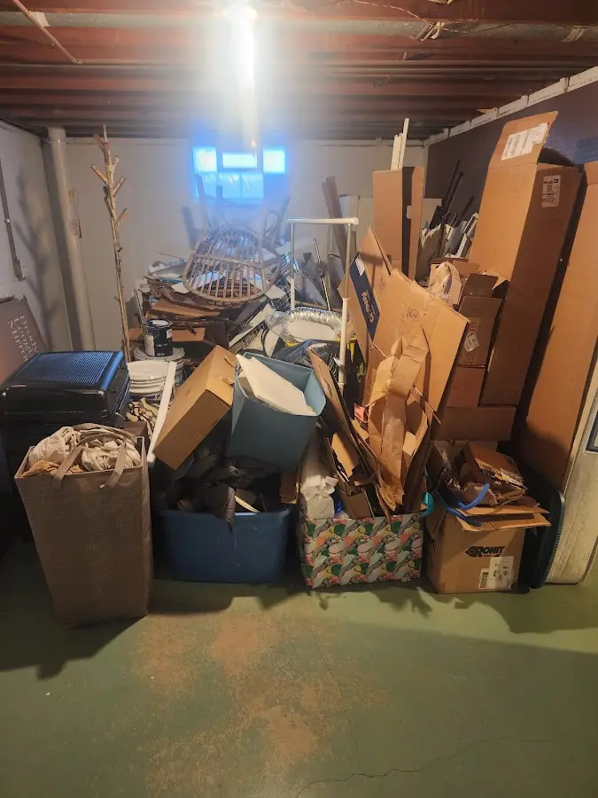 Roll-off dumpster container at job site for 2 Yard Dumpster Rental in Oak Island